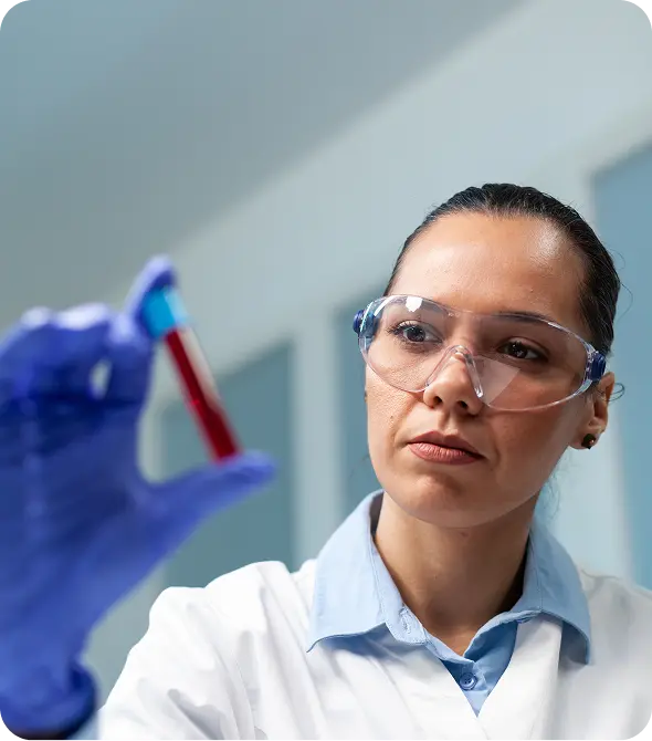 Scientist doctor holding blood vacutainer analyzing biochemistry experiment microbiology hospital laboratory chemist woman developing healthcare treatment against disease.